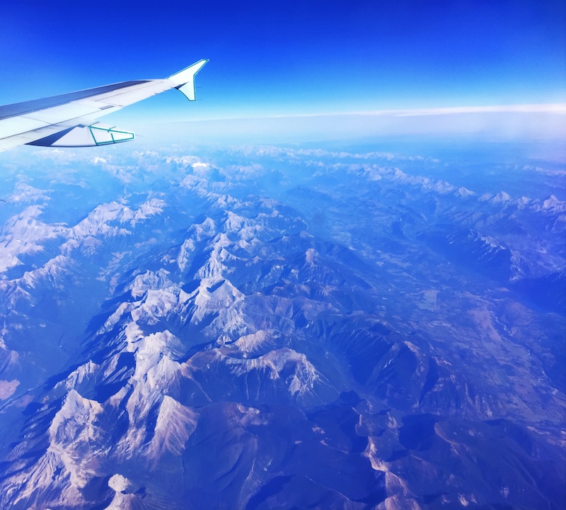 airplane wing over rockies